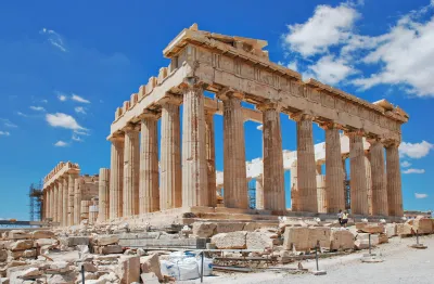 the Parthenon against a bright blue sky
